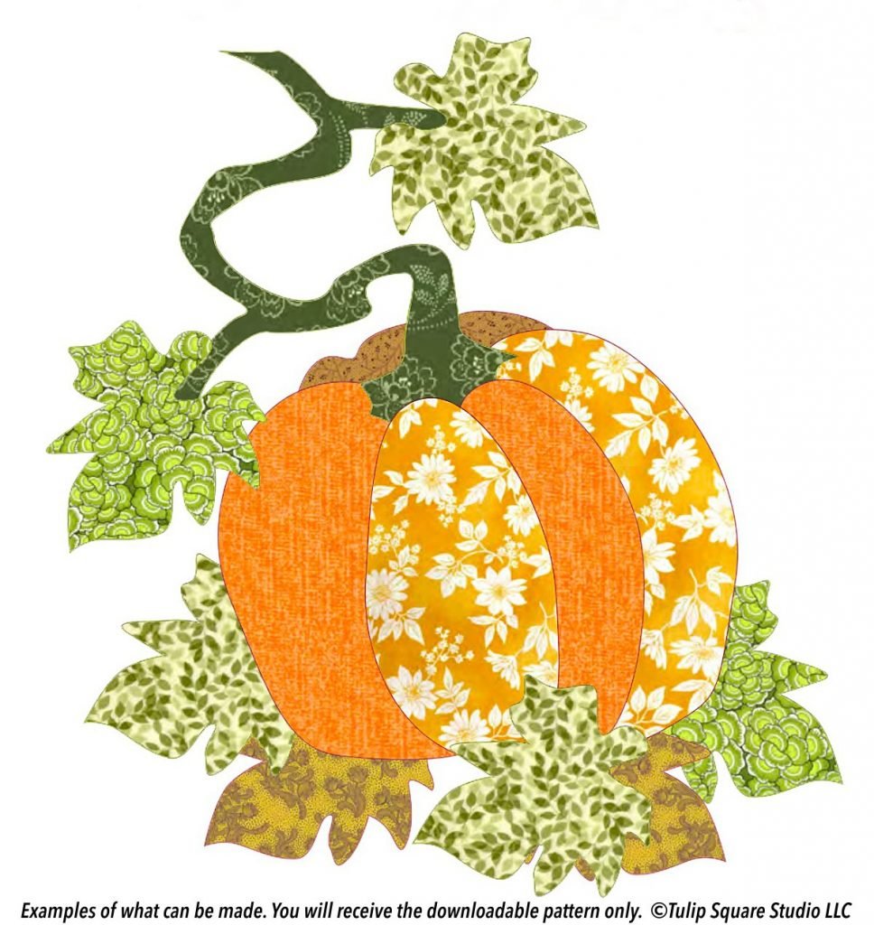 A pumpkin on a leafy vine, done in appliqué with patterned fabrics in shades of green and orange.
