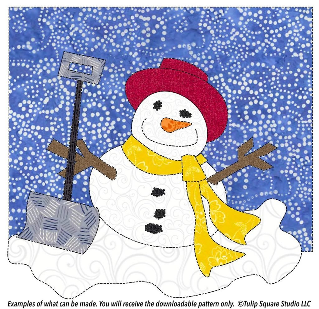 Drawing of a happy snowman, created in fabric scraps, on a background of blue fabric with white swirls.