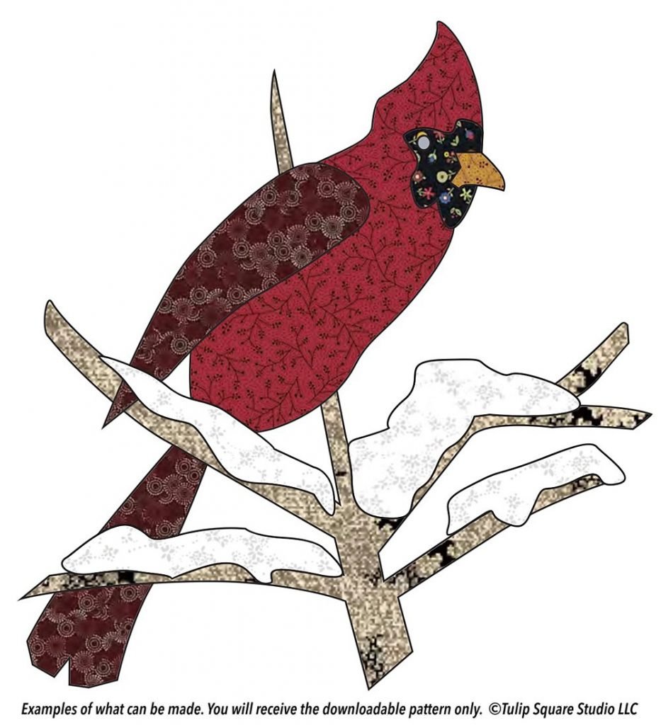 Graphic of a red cardinal on a snowy branch, appliquéd in patterned fabrics.