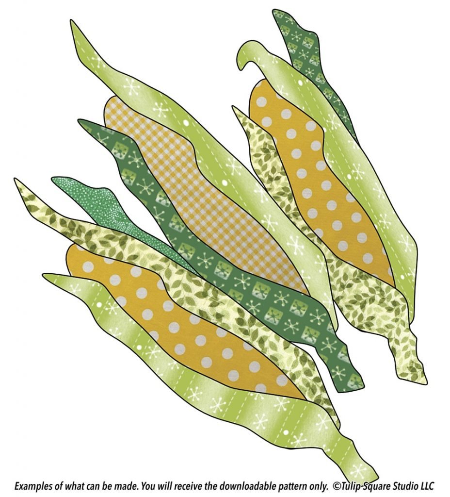 Three ears of corn made of fabric appliqué in green and yellow patterns.